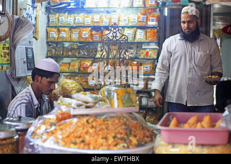 Mumbai, Maharashtra, India. 4th Sep, 2013. 4 Sept. 2013 : Bhendi Bazaar, Mumbai, INDIA:.Fakhruddin Mithaiwala who owns a small snack shop at Bhendi Bazaar is happy about the re-development project under taken by the Saifee Burhani Upliftment Trust.STORY :.In Bhendi Bazaar, a market district, in the heart of Mumbai, dilapidated old buildings line the streets. Many have cramped, dark, dingy interiors with crumbling staircases. Some are precariously supported by bamboo poles. Giant rats scurry across the floors. Such decayed surroundings ought to be deserted, but Bhendi Bazaar district, w Stock Photo