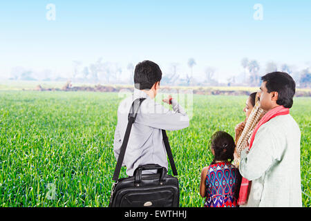 indian Rural Parents and Salesman farm  Discussion Stock Photo