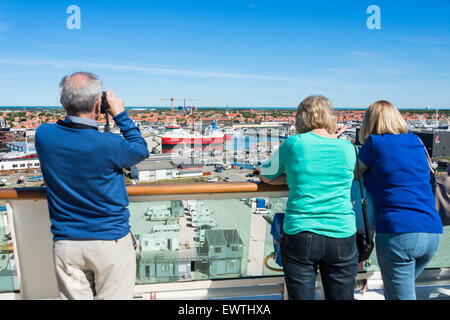 Passengers viewing from deck of Royal Caribbean 'Brilliance of the seas' cruise ship, Skagen, North Jutland region, Denmark Stock Photo