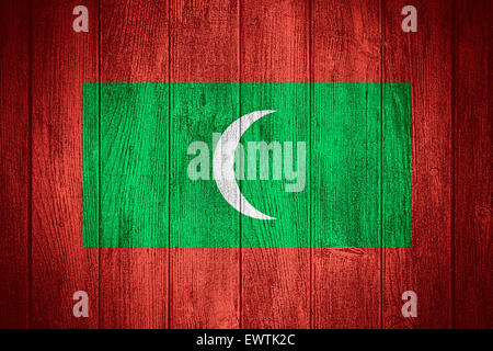 Maldives flag or Maldivian banner on wooden boards background Stock Photo