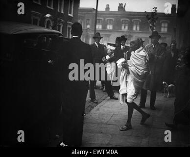 Mohandas 'Mahatma' Gandhi, leader of the  Indian independence movement in British-ruled India, pictured during his visit to Britain in 1931. Mahatma Gandhi seen here entering a car as he leaves Kingsley Hall at Bromley by Bow, East London. 14th September Stock Photo
