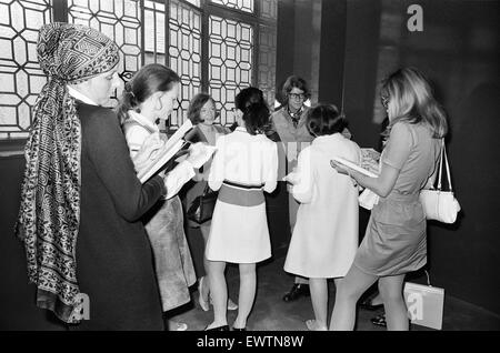 Yves Saint Laurent, designer, pictured speaking with journalists at the opening of his first London Rive Gauche store on New Bond Street, London, 10th September 1969. Stock Photo