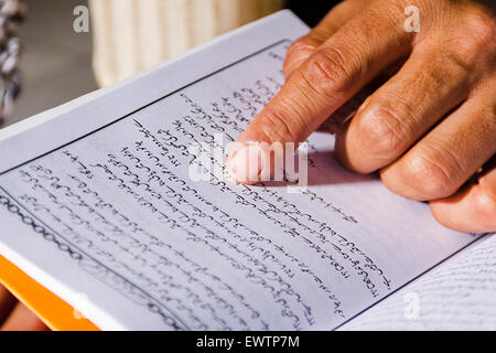 1 Muslim man Reading Quran book Stock Photo
