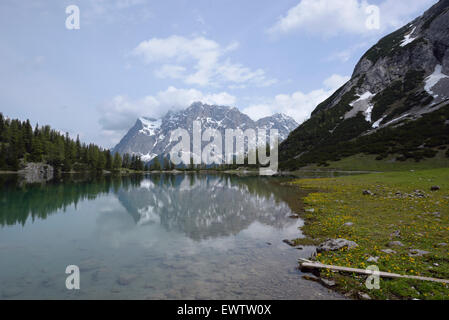 Zugspitze massif reflecting in mountain lake Seebensee, Austria Stock ...
