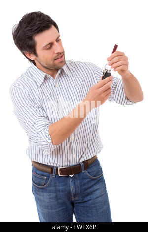 Young adult holding the keys of a new car Stock Photo