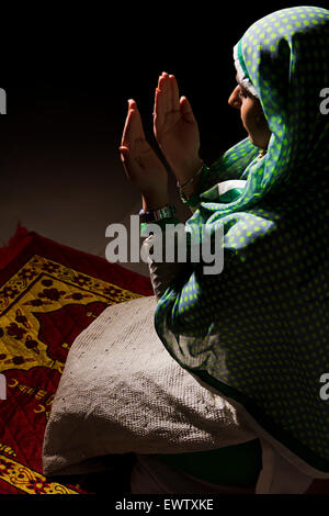 1 indian Muslim woman Namaz Stock Photo