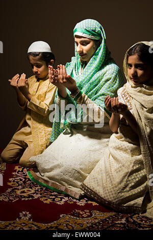 indian Muslim mother and kids Namaz Stock Photo