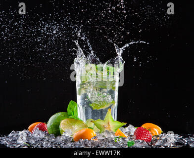 Mojito drink with splash, isolated on black background Stock Photo