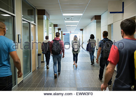 College students walking down corridor