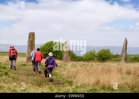 Visitors by Standing stones at Machrie Moor stone cirles on Isle of Arran, North Ayrshire, Strathclyde, Scotland, UK, Britain Stock Photo