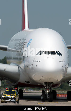 Duesseldorf, Germany. 01st July, 2015. An Airbus A380 of the Emirates airline stands on a park position at the airport in Duesseldorf, Germany, 01 July 2015. The largest passenger jet of the world, the Airbus A380, starts to operate from Duesseldorf regularly. Photo: FEDERICO GAMBARINI/dpa/Alamy Live News Stock Photo