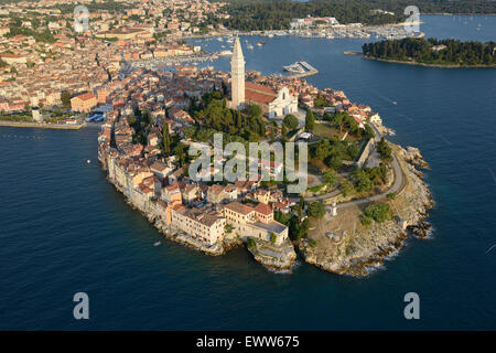 AERIAL VIEW. The Church of St. Euphemia crowning the old town of Rovinj (also named Rovigno) standing on a picturesque peninsula. Istria, Croatia. Stock Photo