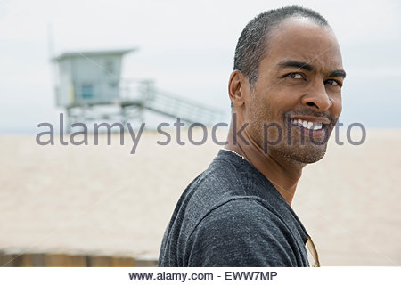 Close up portrait smiling man at beach