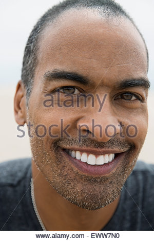 Close up portrait smiling man with stubble