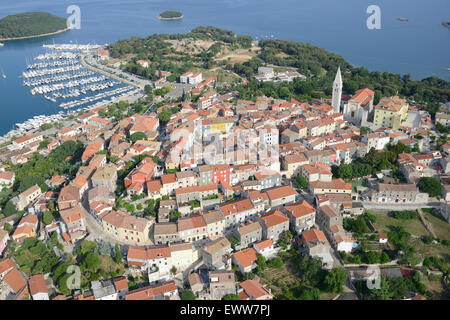 AERIAL VIEW. Medieval hilltop village overlooking the Adriatic coast. Vrsar (also known as Orsera, its Italian name), Istria, Croatia. Stock Photo