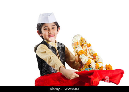 1 indian Marathi child boy Ganpat Sculpture Worship Stock Photo