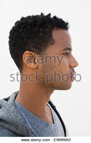 Close up profile portrait serious man black hair