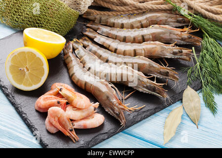 Fishing float, fishing bobber on the wooden pier. Fishing rod and fishing  equipment on the jetty at the lake in the forest. Fishing concept. 25442275  Stock Photo at Vecteezy