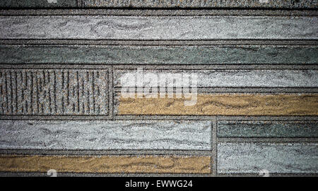 Old wall made of colored resin stone slabs, close up background Stock Photo