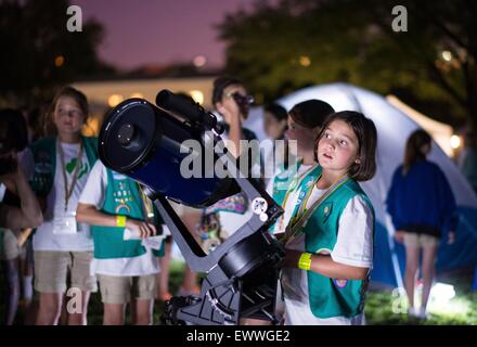 A group of Girl Scouts wait their turn to view Jupiter through a telescope during stargazing at the first-ever White House Campout with fifty fourth-grade girls as part of the Let's Move! Outside initiative on the South Lawn of the White House June 30, 2015 in Washington, DC. Stock Photo