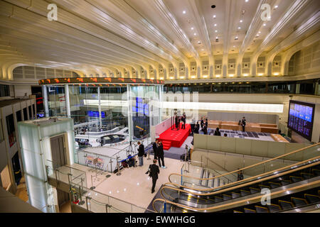 News reporters set up inside the Tokyo Stock Exchange in Tokyo, Japan. Stock Photo