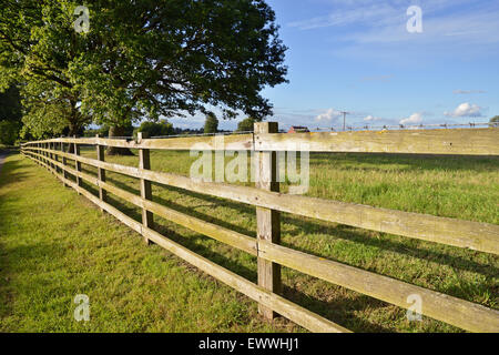 Low angle view of wooden fence in rural area Stock Photo