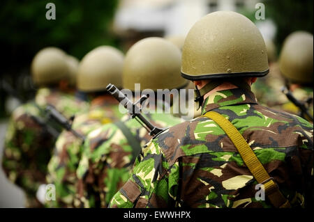 Group of unrecognizable soldiers in camouflage uniform ready for war Stock Photo