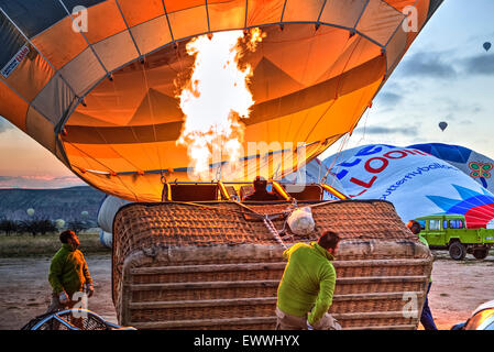 men fill a hot air balloon before departure in Cappadocia, Turkey Stock Photo