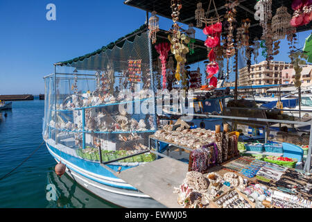 Crete Chania harbour Greece souvenirs Boat sale seashells Chania market boat Stock Photo
