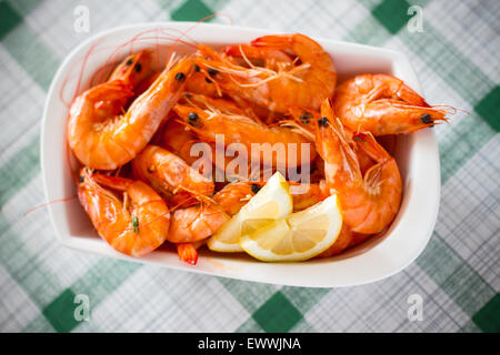 Fresh grilled shrimps with lemon close up, top view Stock Photo