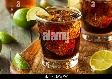 Rum and Cola Cuba Libre with Lime and Ice Stock Photo