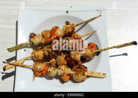 Grilled scallops served at the restaurant of the Domaine de Massereau campsite in Sommieres, France. Stock Photo
