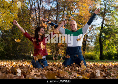 Young Couple In Autumn Park Stock Photo