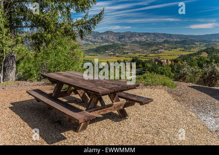 Redwood picnic table on hill overlooking Napa Valley Stock Photo