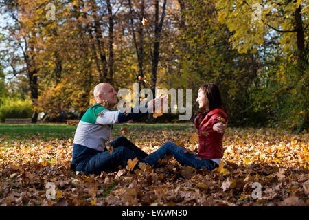 Young Couple In Autumn Park Stock Photo