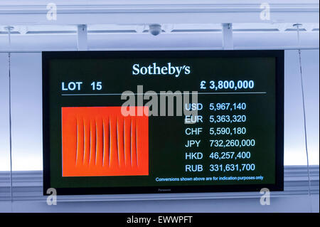 London, UK. 1 July 2015. An LCD monitor shows Lucio Fontana's 'Concetto Spaziale Attese', which sold for a hammer price of £3.8m, slightly below estimate, at Sotheby's Contemporary Art evening auction.  The night's total sales realised £130.4 million ($204.7 million).  Credit:  Stephen Chung / Alamy Live News Stock Photo