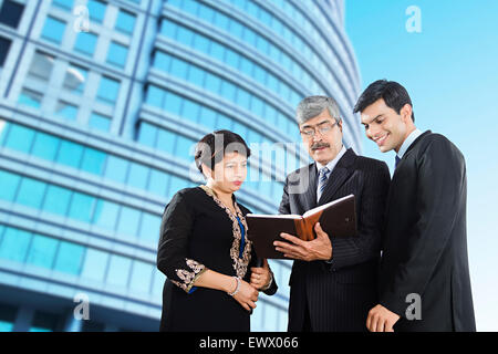 3 indian Business partner Book  reading Discussion Stock Photo
