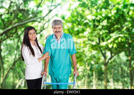 indian Doctor and Patient Support Walker Walking Stock Photo