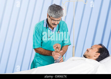 indian Doctor Patient Checking Stock Photo