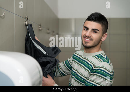 Muslim Man Preparing To Take Ablution In Mosque Stock Photo