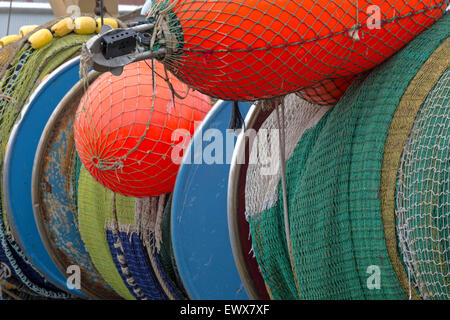 Still life of fishing gear, such as colorful nets, buoys and floats in the harbor of IJmuiden, North Holland, The Netherlands. Stock Photo