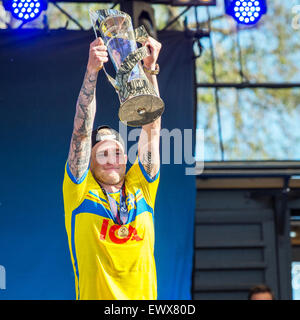 John Guidetti shows the trophy as Swedish football players are welcomed back to Sweden as UEFA European Under-21 champions. Stock Photo