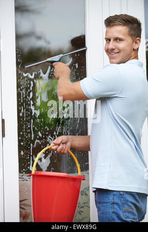 Portrait Of Man Cleaning House Windows Stock Photo