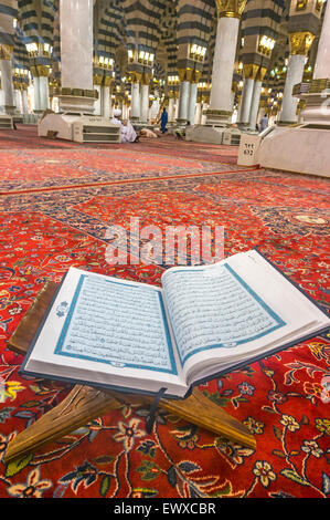 MEDINA, SAUDI ARABIA - MARCH 08, 2015 : A Quran inside Nabawi mosque Stock Photo