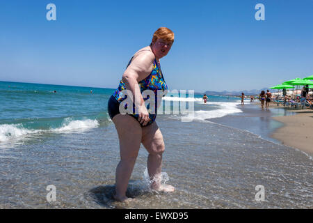 Beach of Rethymno, Crete, Greek Island, Greece, Europe, Overweight senior obese woman holidaymaker, beach Overweight woman fat Stock Photo