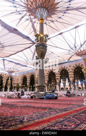 MEDINA-MAR 08:Muslims rest and pray inside of Masjid Nabawi March 08, 2015 in Medina, Saudi Arabia. Nabawi Mosque is the second  Stock Photo