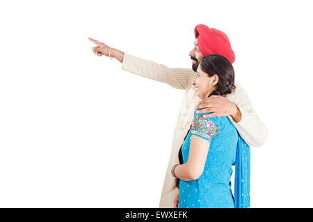 2 indian Punjabi Married Couple finger Pointing Stock Photo