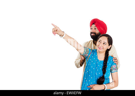 2 indian Punjabi Married Couple finger Pointing Stock Photo