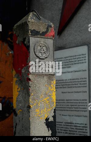 Memorial post bearing DDR name at Checkpoint Charlie in Berlin, Germany Stock Photo