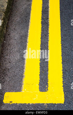 Newly painted double yellow lines Stock Photo